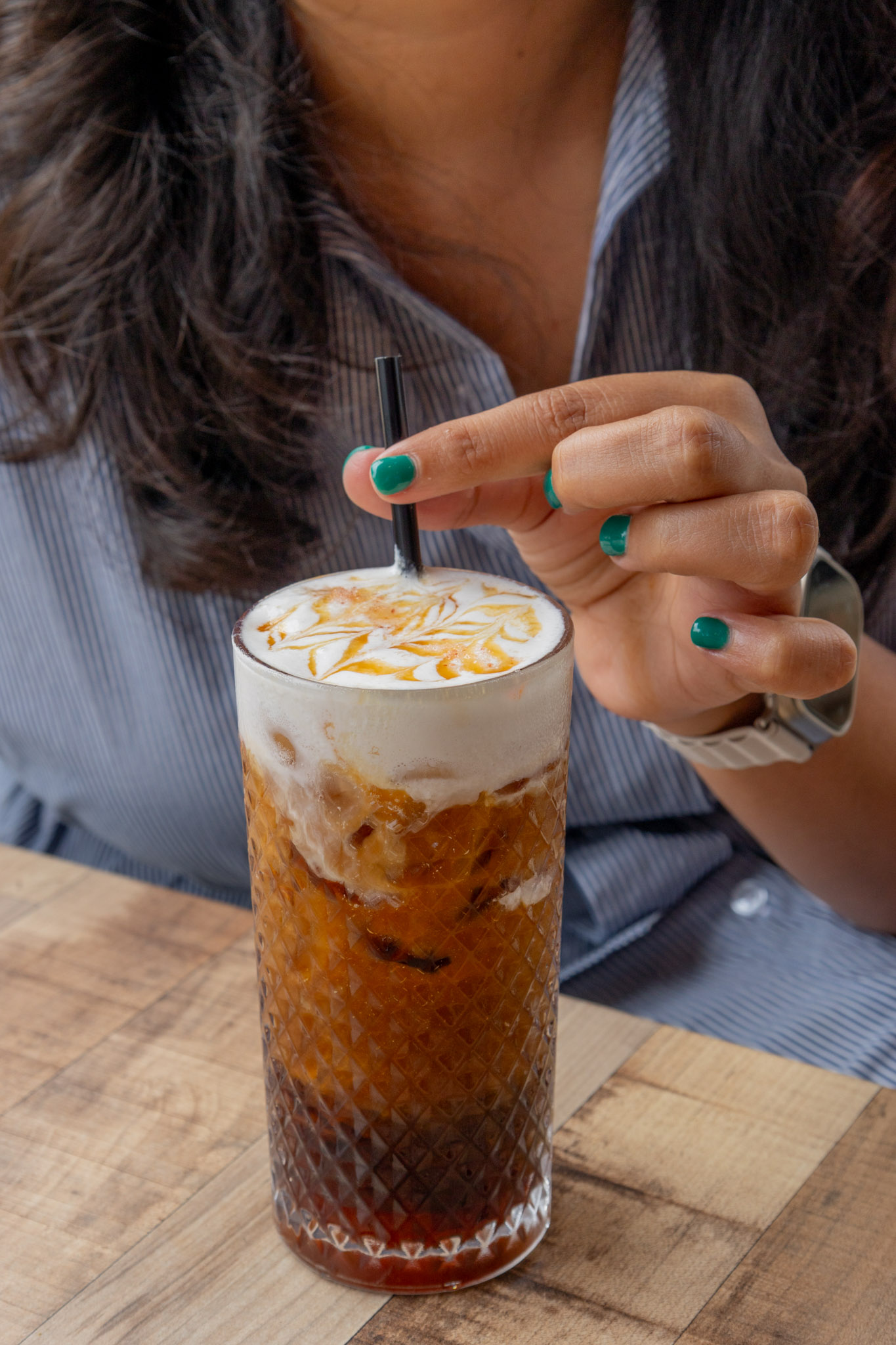 Iced coffee with foam and caramel