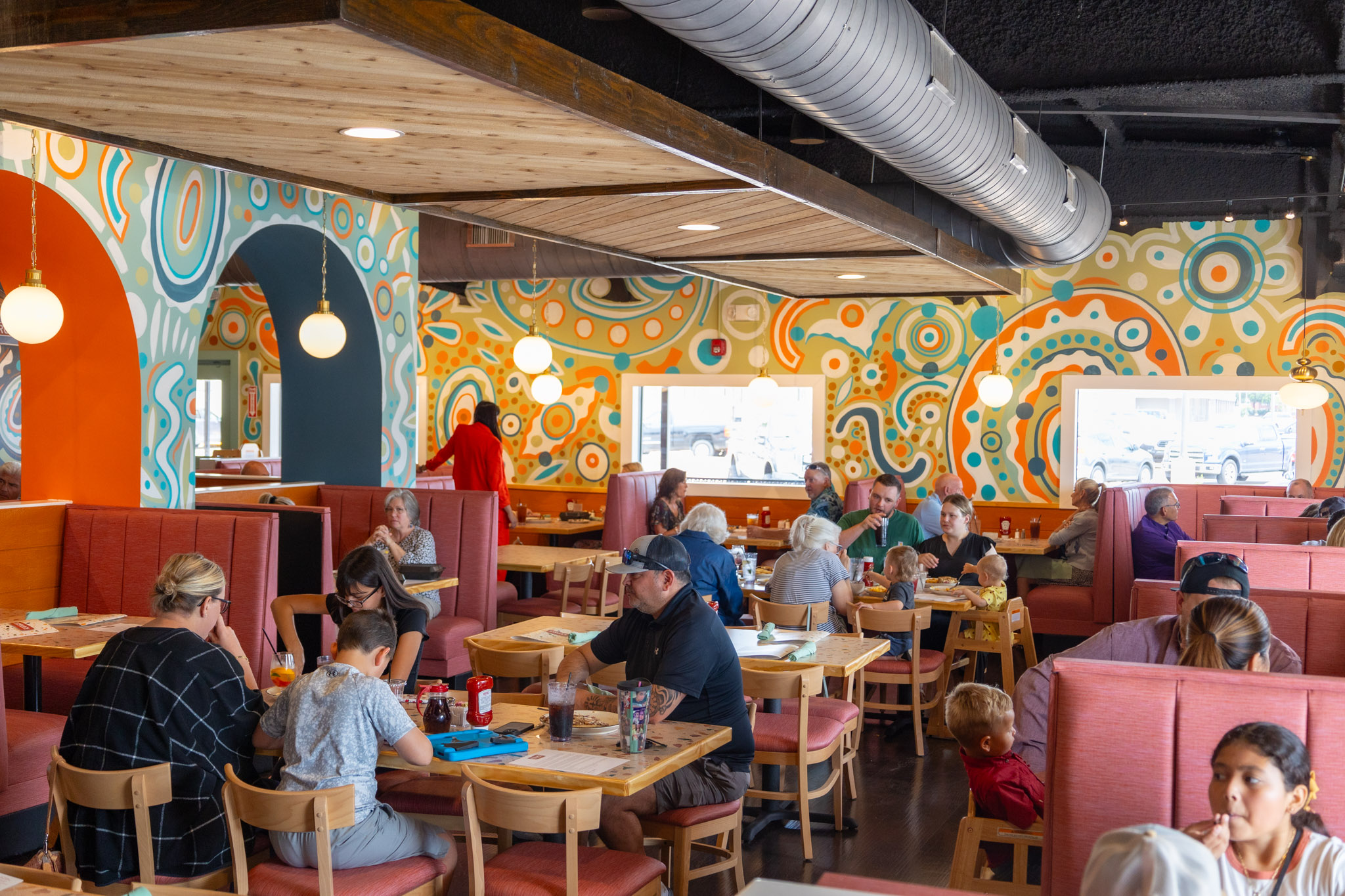 Guests dining inside Stella's colorful brunch restaurant
